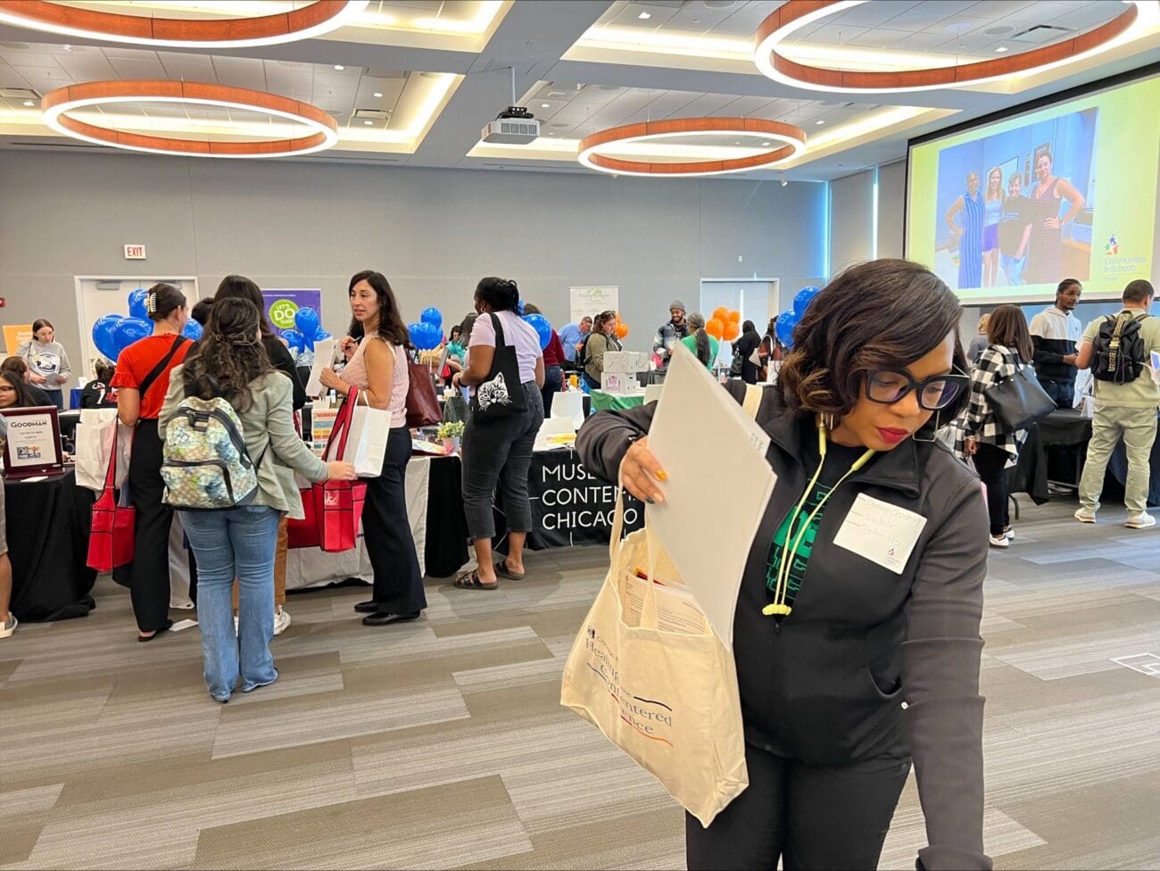 School partner visits a table at CIS Resource Fair